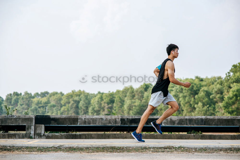 Similar – Black man running outdoors in urban road