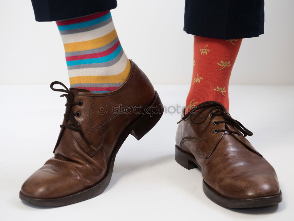 Similar – stylish men’s socks. Stylish suitcase, men’s legs, multicolored socks and new shoes. Concept of style, fashion, beauty and vacation