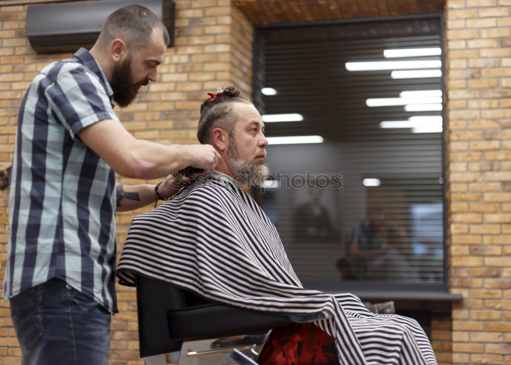 Similar – Barber doing face massage to man