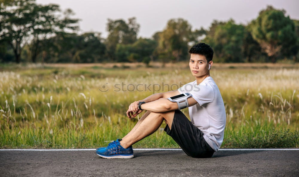 Similar – Image, Stock Photo Young man in sportswear leaning on metal fence and posing on sta