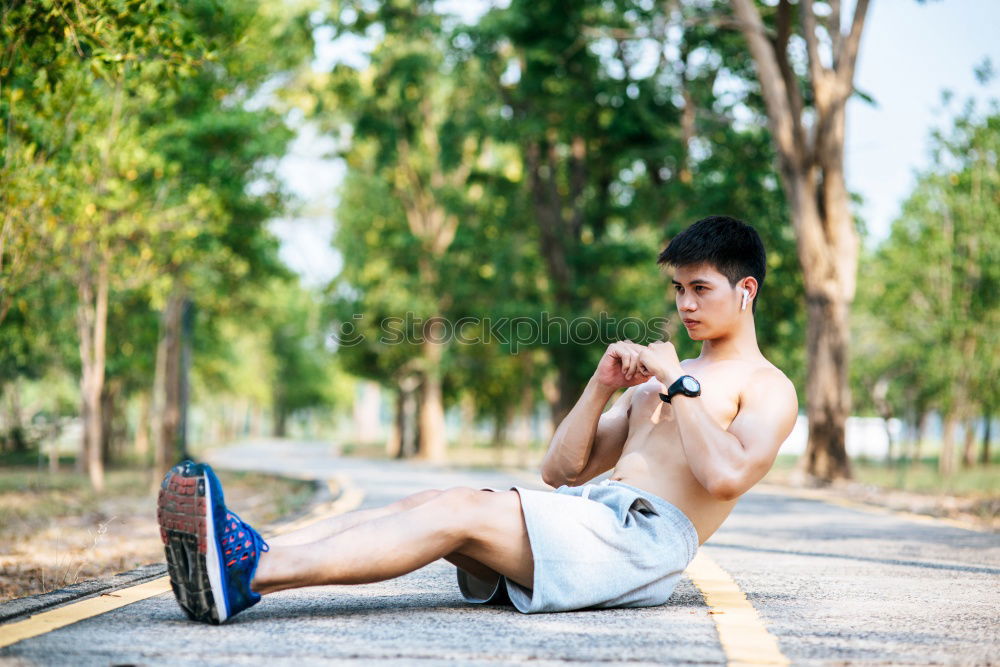 Similar – Image, Stock Photo Young sports man sitting at staircase with water bottle break