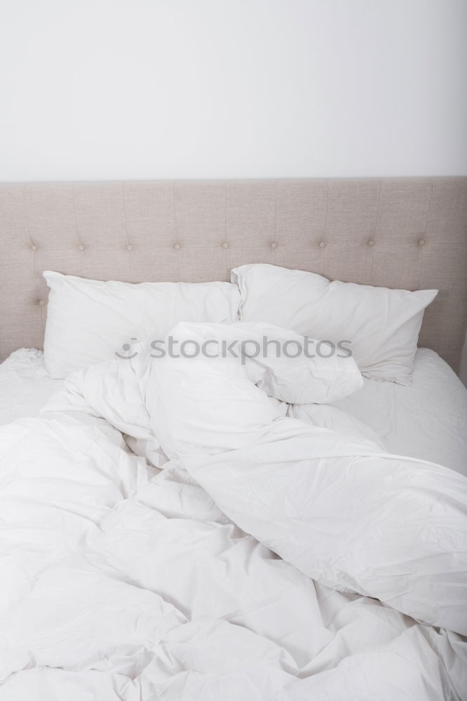 Similar – Image, Stock Photo A bed with two feet coming out of the sheets