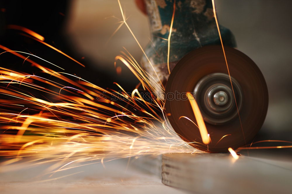 worker using an angle grinder