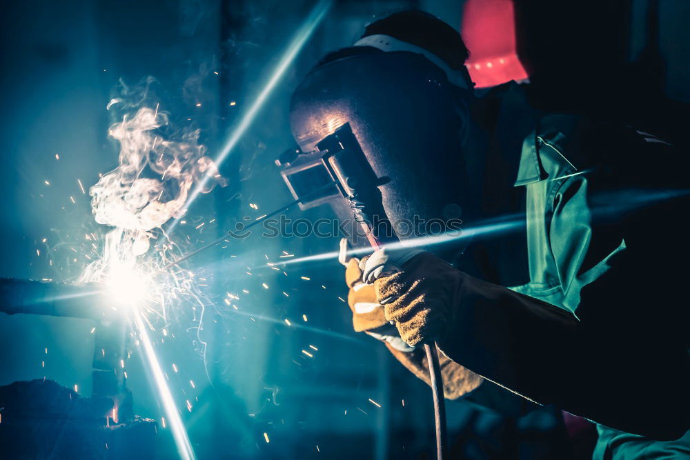 Similar – Man cutting iron