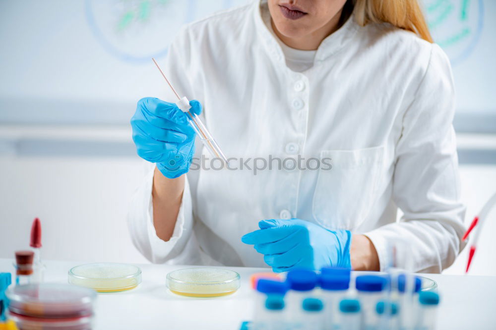 Similar – Image, Stock Photo Worker putting liquid to test tube