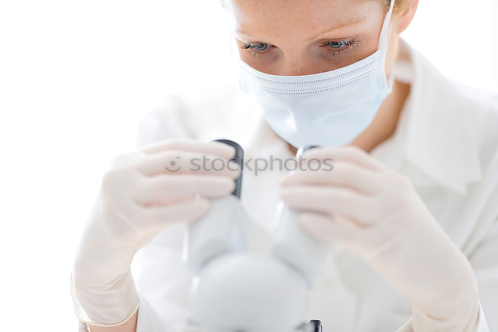 Similar – portrait of doctor woman wearing protective mask and gloves indoors. Using mobile phone. Corona virus concept