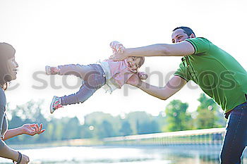 Similar – Image, Stock Photo Man and woman holding hands of happiness little girl