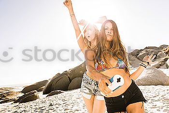 Similar – Women posing in sandy hills