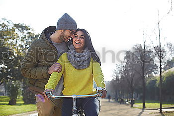 Similar – Young couple embracing and laughing outdoors under umbrella