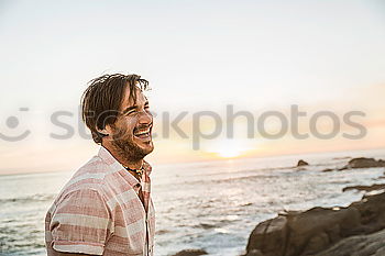 Similar – Image, Stock Photo Man standing on rocky beach