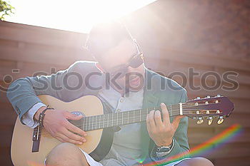 Similar – outdoor photo session with a bass player and his instruments