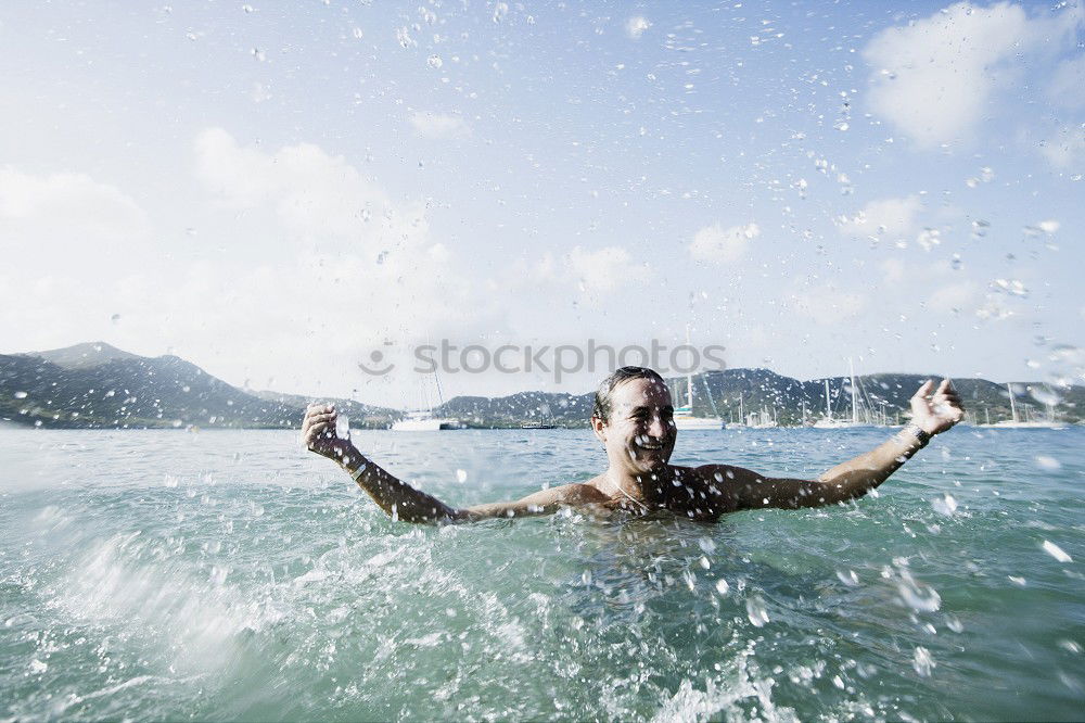 Similar – Image, Stock Photo Man in wetsuit swimming in ocean