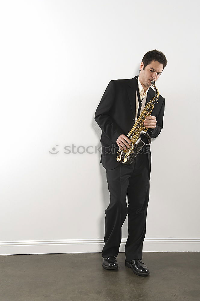 Similar – Smiling jazzman with sax