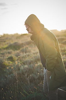 Similar – Image, Stock Photo Boy packing his clothes to backpack on trail