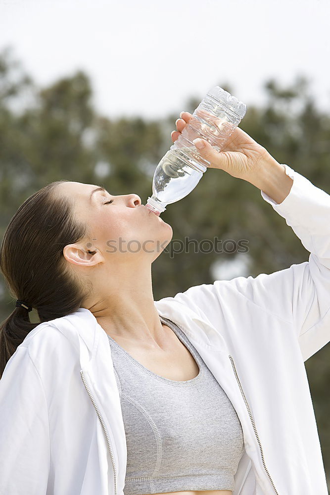 Similar – Young man drinking bottled water