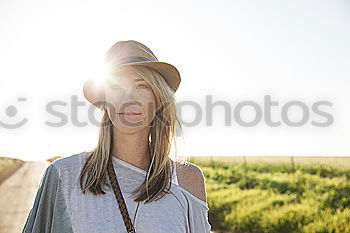 Similar – Bearded man in hat against sunlight