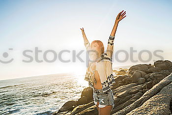 Similar – Image, Stock Photo Beautiful young woman wearing a bikini in a wooden foot bridge at the beach