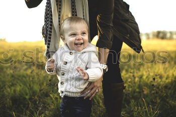 Similar – Foto Bild Mutter hält ihren kleinen Sohn in die Luft und das Baby lacht.