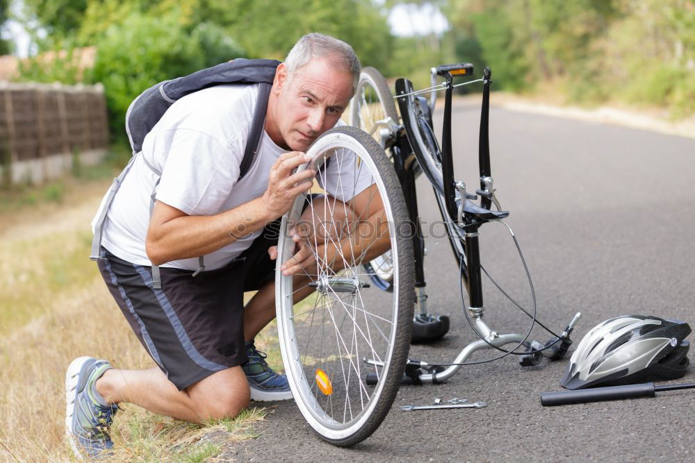 Similar – father and daughter fixing problems with bicycle