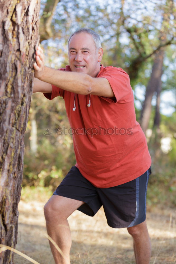 Similar – Fit shirtless young black man doing stretching after running