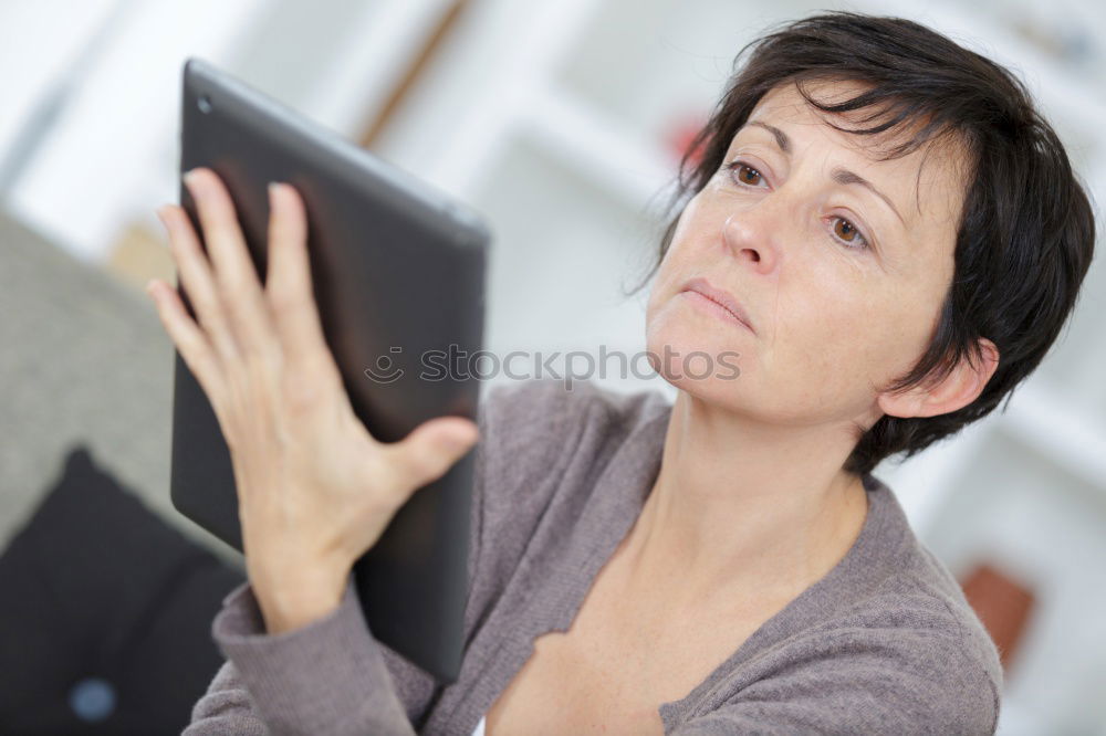 Young woman with tablet computer or ebook reader