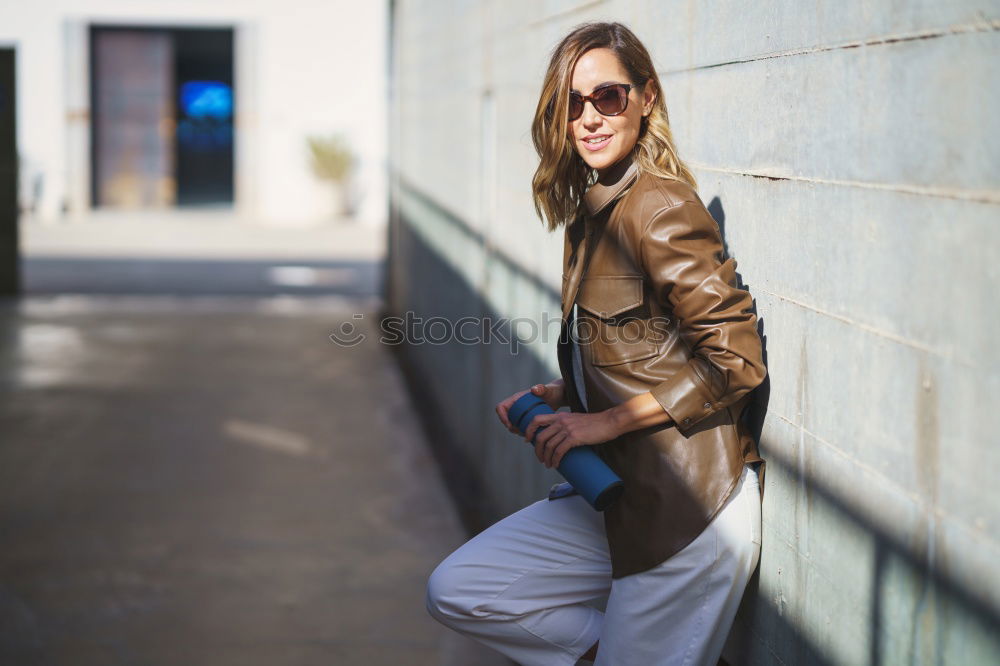 Similar – Portrait of young adult female in front of yellow wall