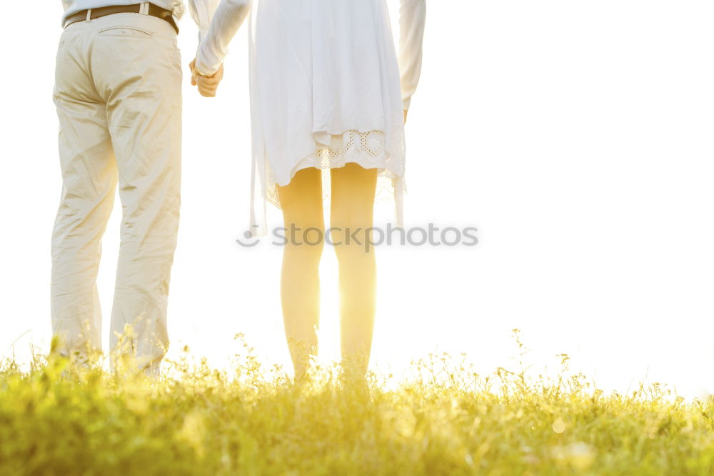 Similar – Image, Stock Photo Unrecognizable hugging couple in sunny street