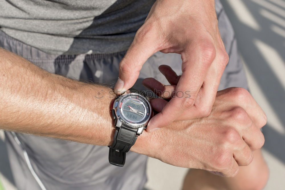 Similar – Sportsman looking a smartwatch