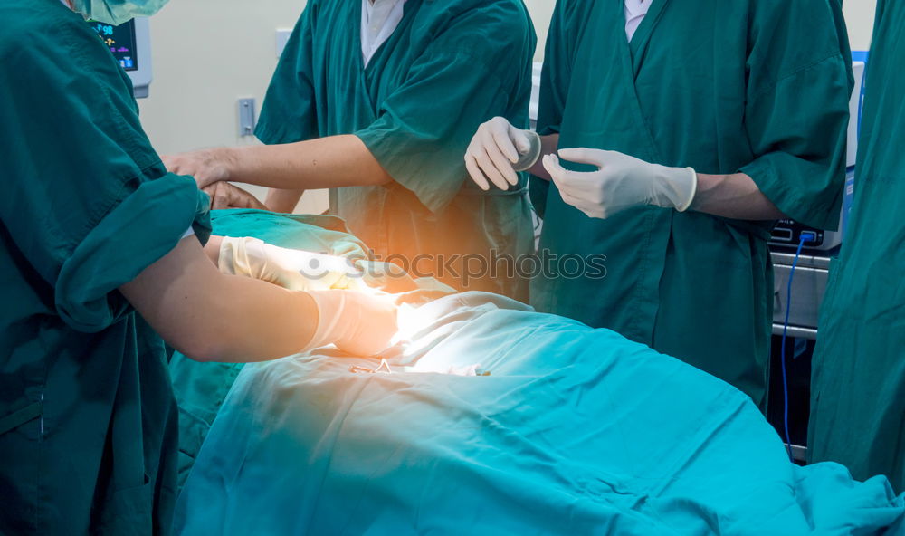 Image, Stock Photo Team of Surgeons Operating.