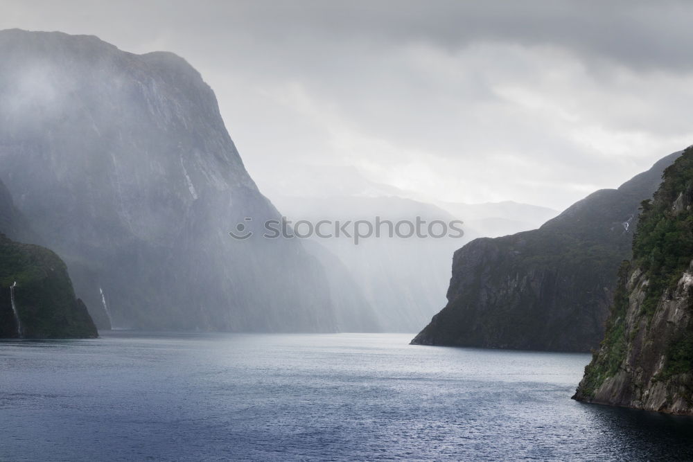 Similar – Rainy atmosphere at the southernmost point of Lofoten with view