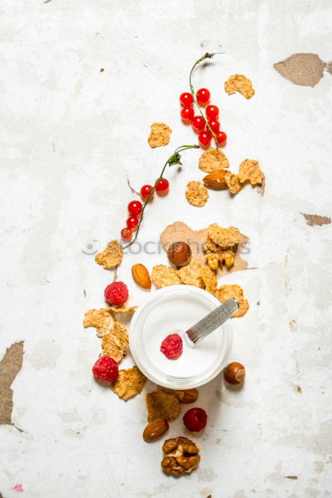 Similar – Healthy breakfast with fresh berries, muesli and nuts