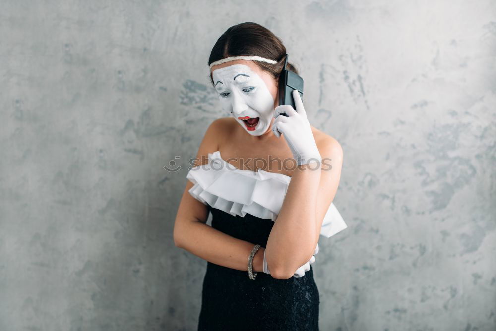 Similar – Young woman wearing bones gloves