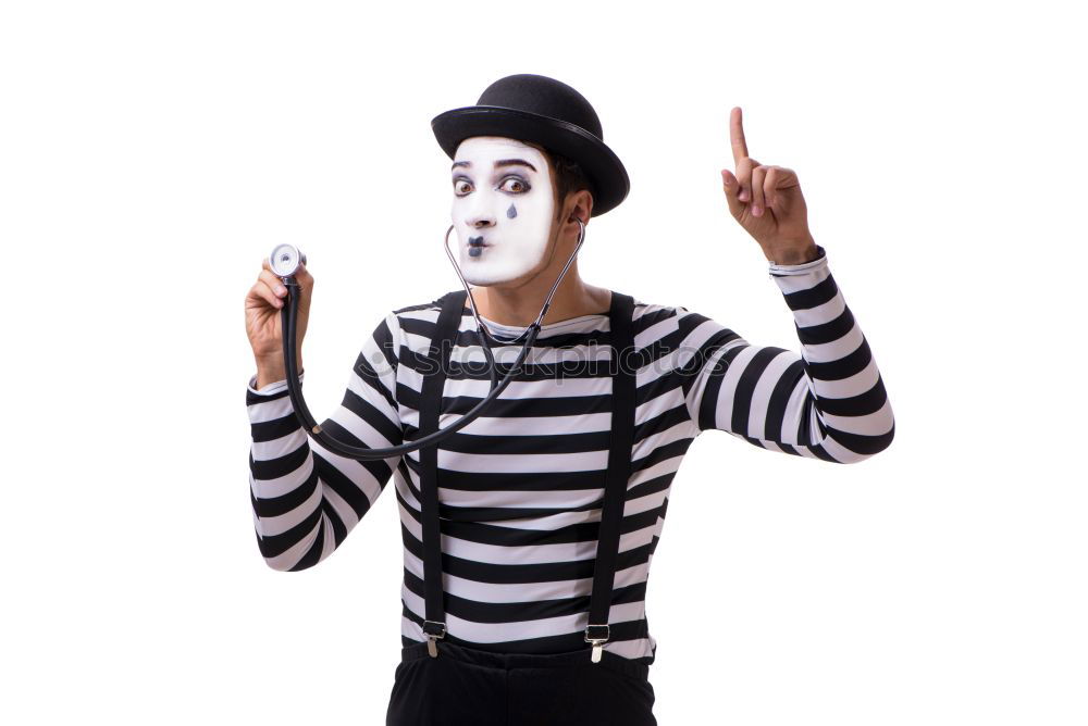 Similar – Young man with a clown costume is holding a little bike