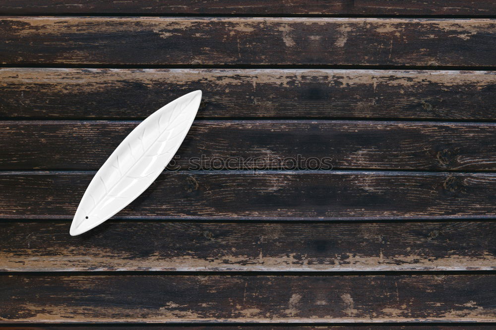 Similar – Knife lies on wooden board