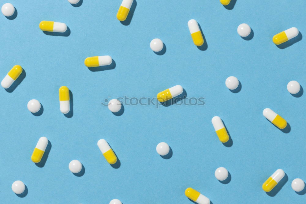 Similar – Image, Stock Photo Two capsule-shaped red and white pills made of paper