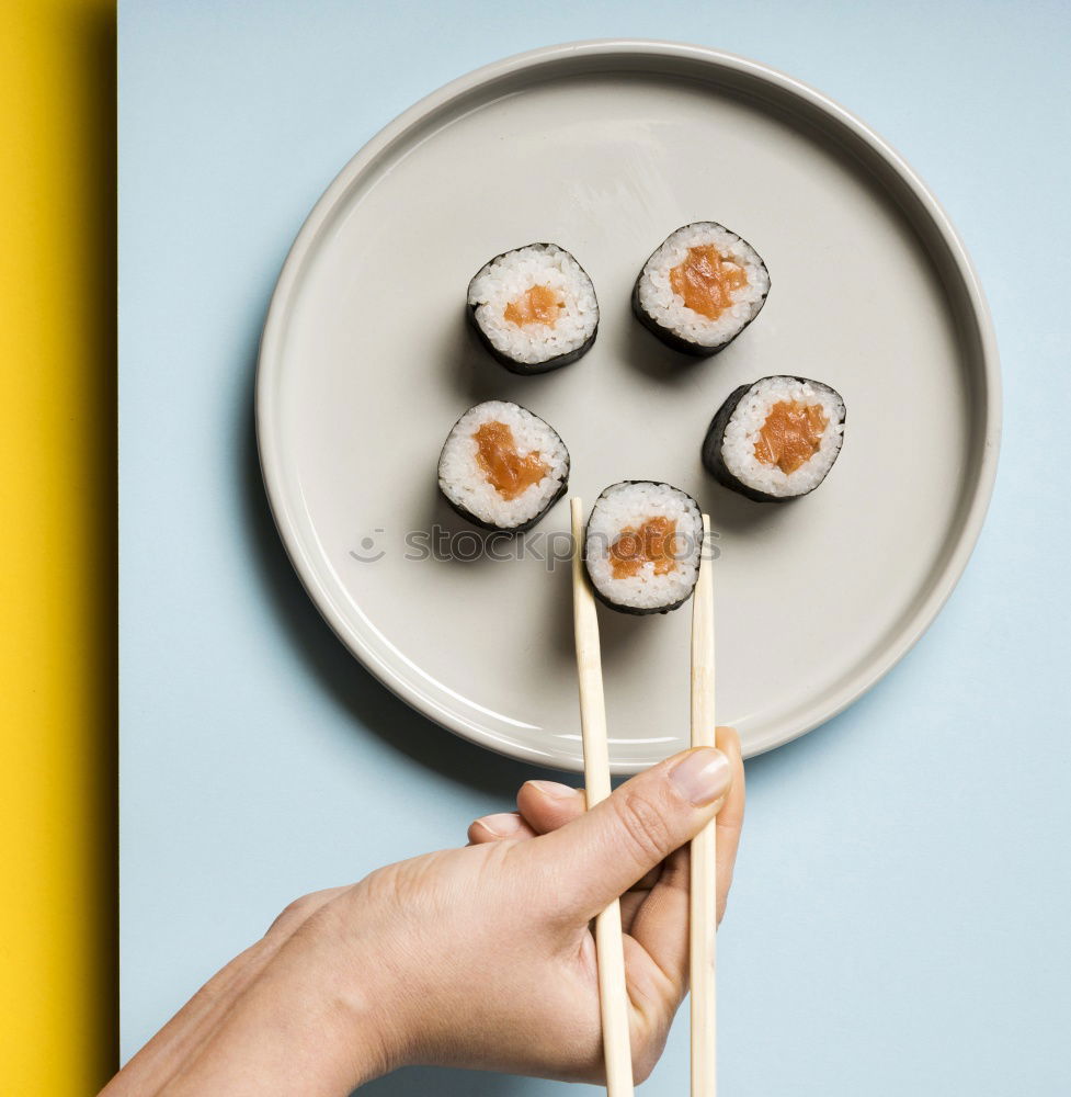 Similar – Crop woman eating sushi