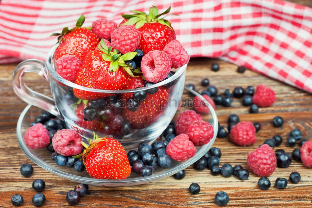 Similar – Fresh yogurt with fruits and muesli on breakfast