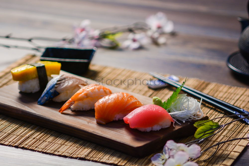 Similar – Crop woman eating sushi