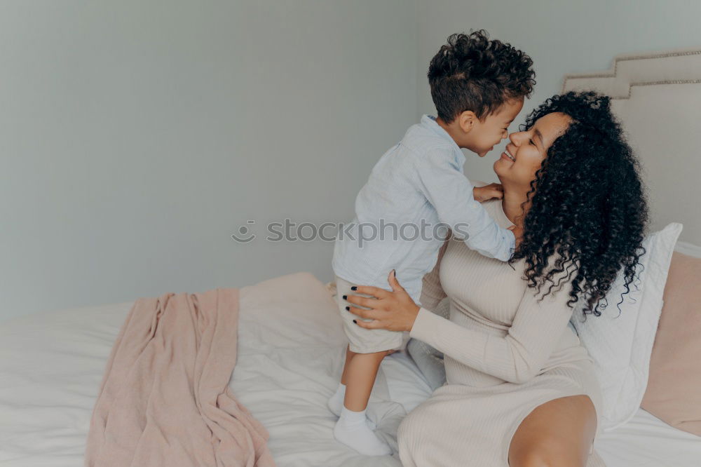 Image, Stock Photo African american mother giving daughter a kiss on cheek