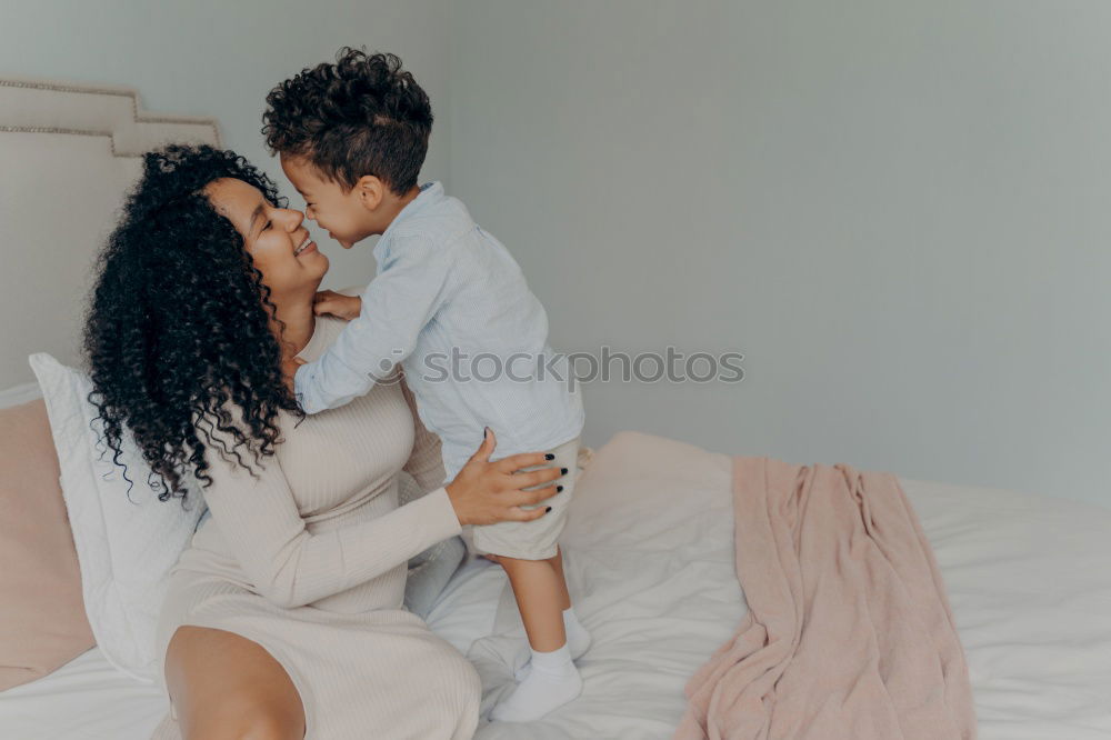 Similar – Image, Stock Photo African american mother giving daughter a kiss on cheek