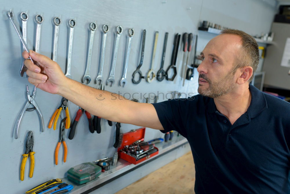 Similar – Image, Stock Photo Mechanic in his workshop taking tools