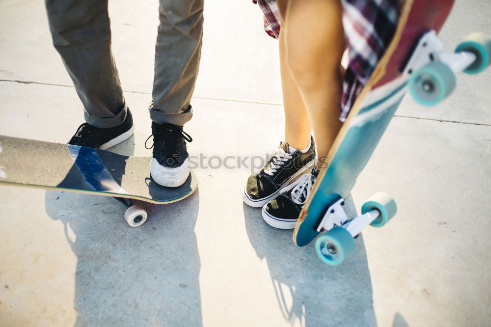 Similar – Man with tattoos holding skateboard at shore. Back view.