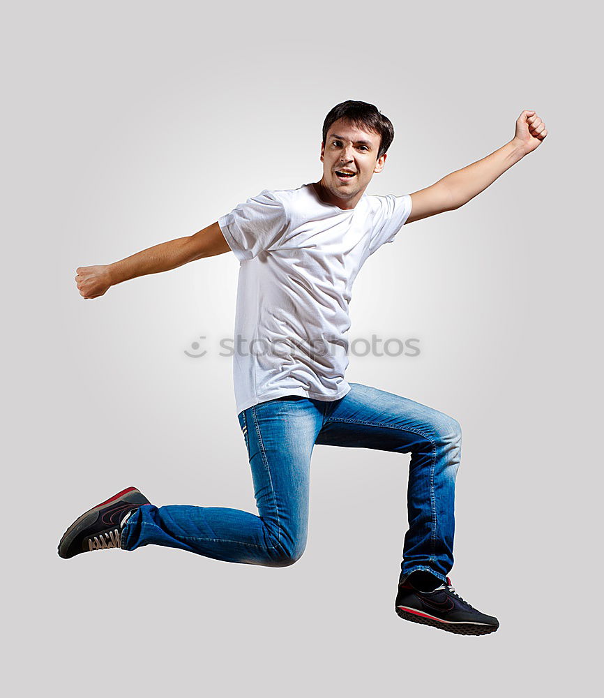 Similar – Image, Stock Photo Young man jumping in urban background