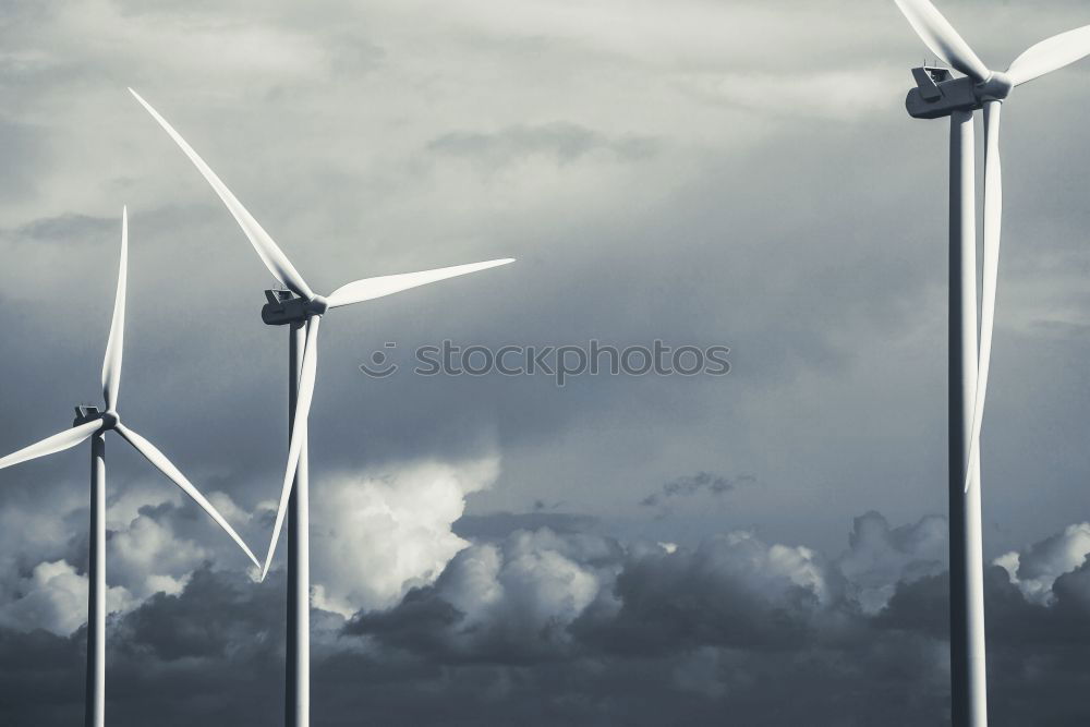 Similar – Image, Stock Photo Wind turbines in front of a lignite-fired power plant