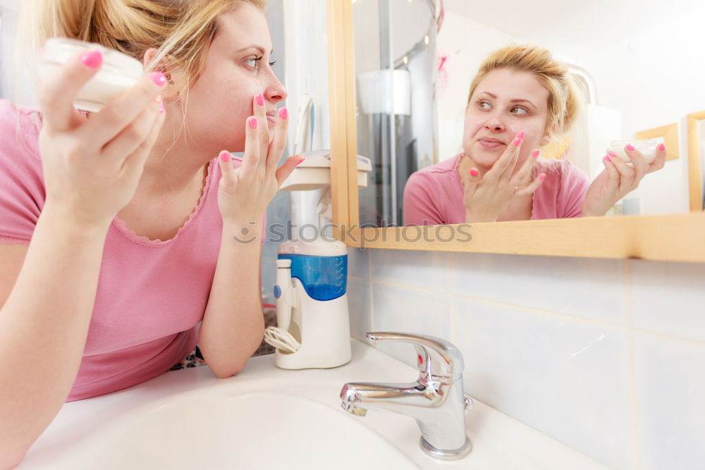 Similar – Young female adult brushing teeth in the morning