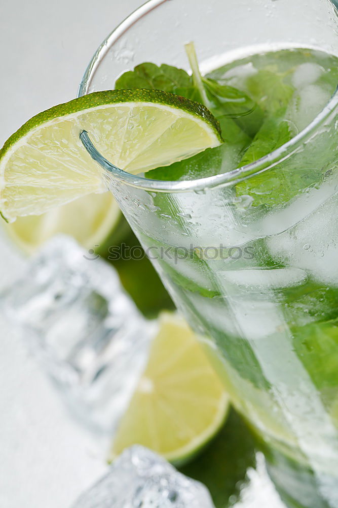 Similar – Mojito cocktail in glass on yellow background