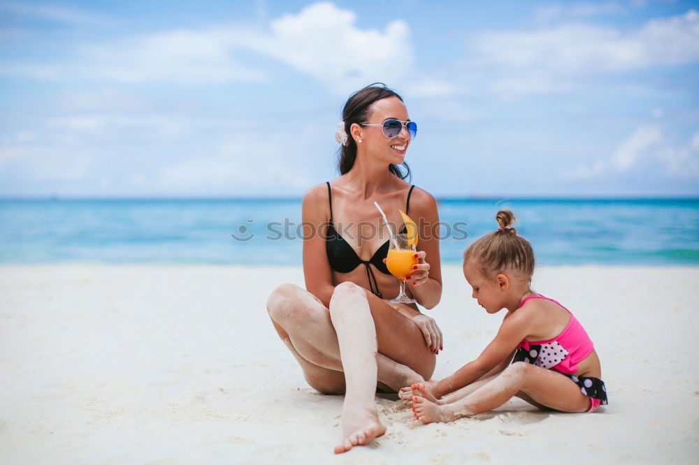 Similar – Image, Stock Photo Mother and toddler son playing with toys at beach