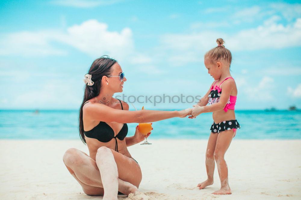 Similar – Image, Stock Photo Mother and toddler son playing with toys at beach