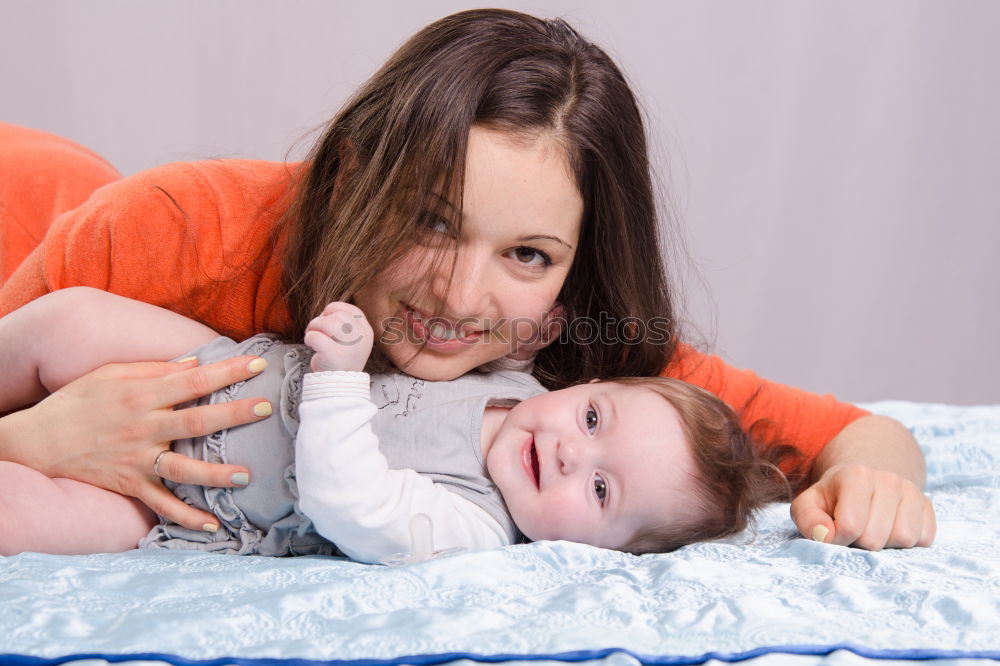 Similar – Baby girl playing with mother and have fun