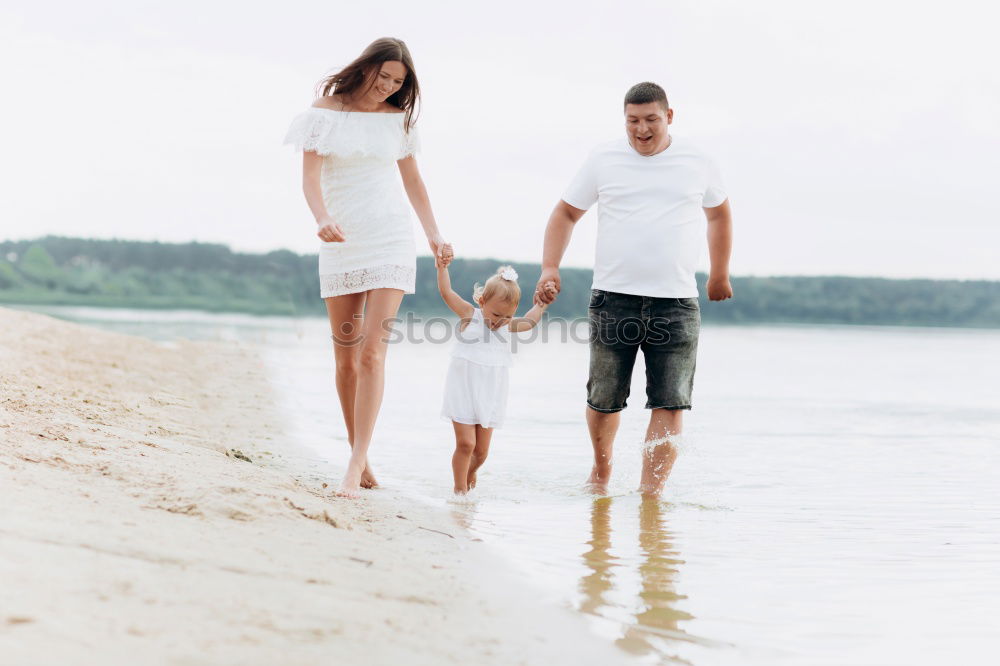 Similar – Image, Stock Photo Father and son playing on the beach at the day time. Concept of friendly family.
